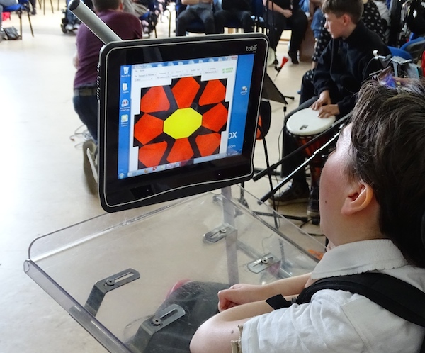 Greta plays music using her eye movements to control Eyegaze software