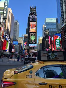 Times Square lights and adverts with Yellow Tazi